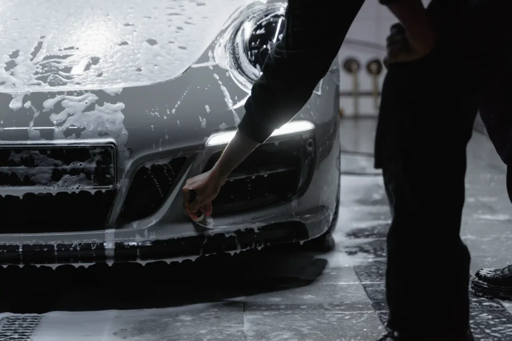 applying paint protection film on a grey car in Richmond